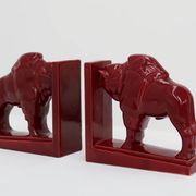 Pair of red glazed ceramic Bison ox bookends in Art Deco style, Belgium