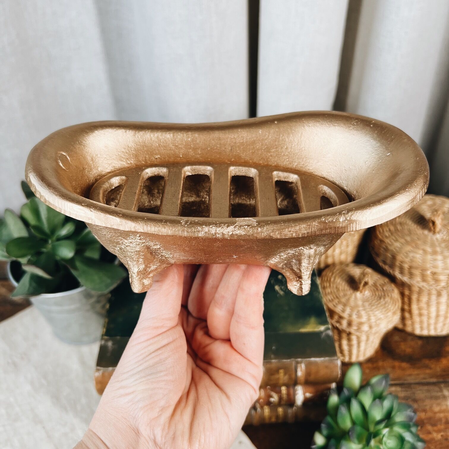 Cast iron soap dish in the shape of a bathtub
