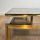 Modernist coffee table in brass and smoked glass tops by Guy Lefèvre for Maison Jansen.