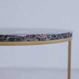 Trundle tables in imperial brown marble.