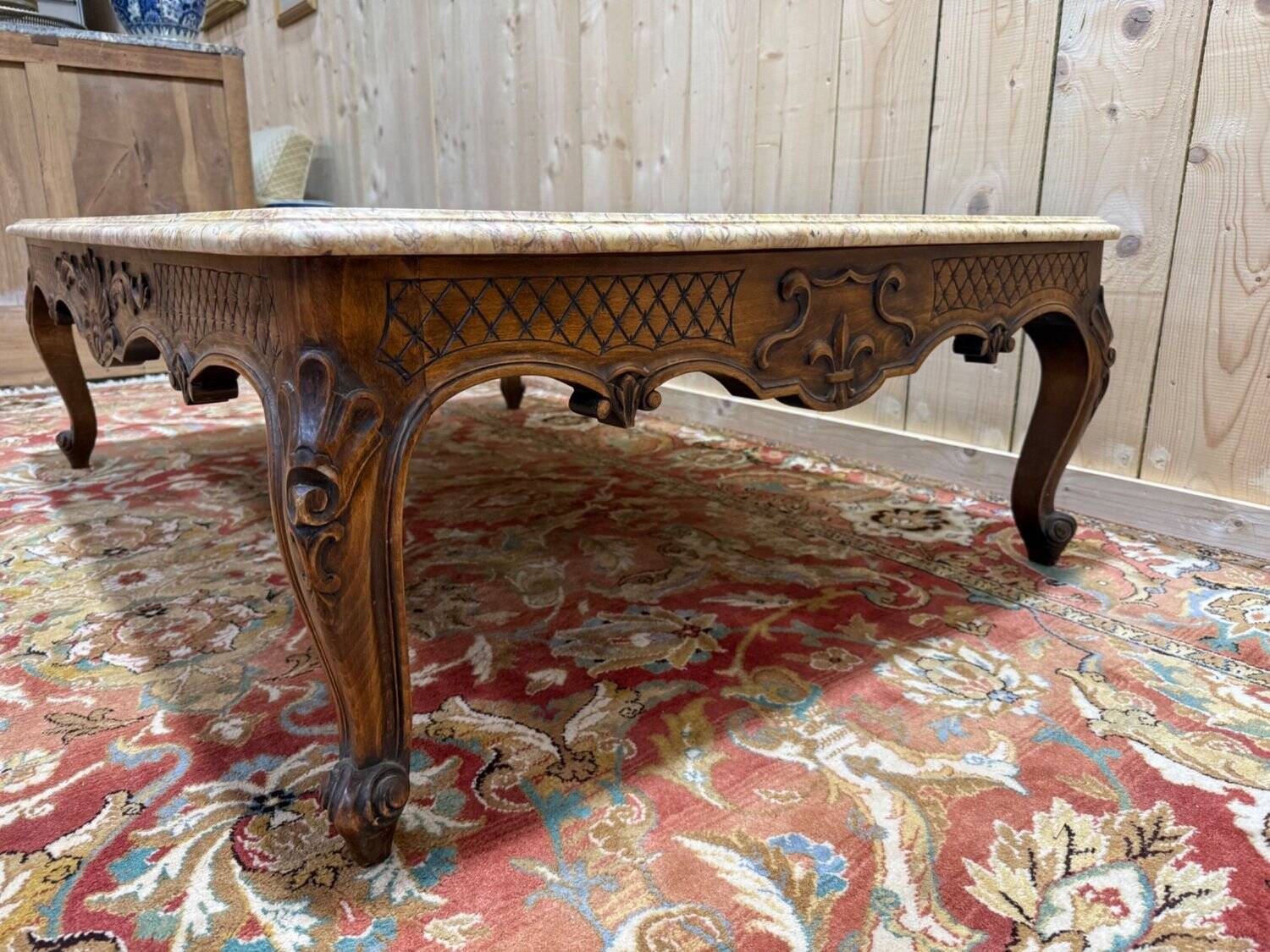 Louis XV style coffee table in walnut with a marble top.