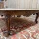 Louis XV style coffee table in walnut with a marble top.