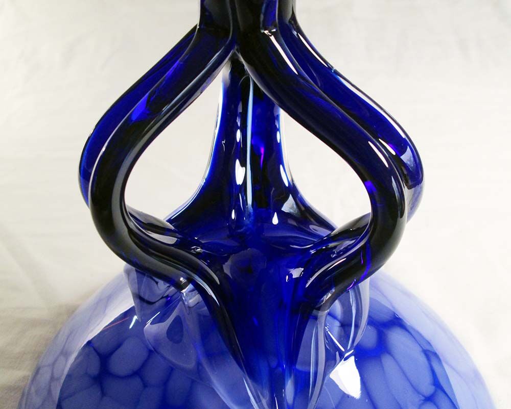 Blue glass cup on foot