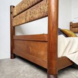 Brutalist style bed with chain and straw