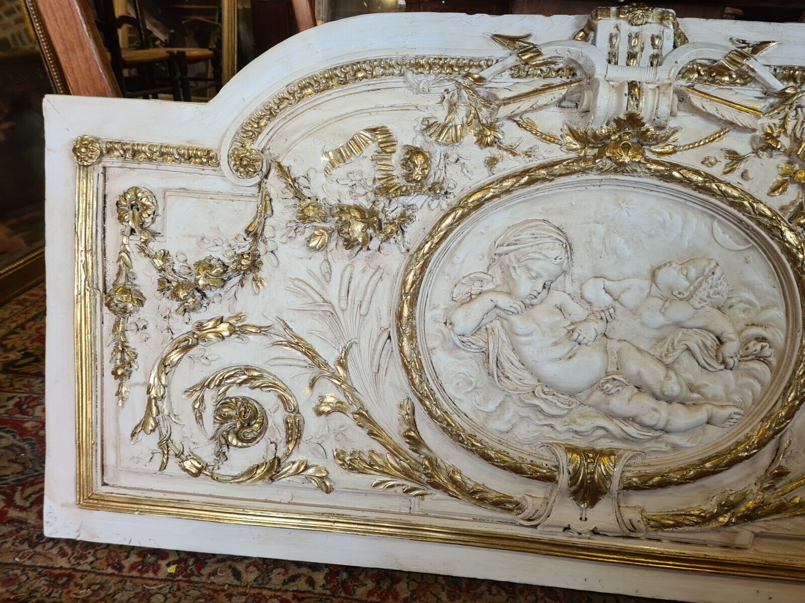 Pediment panel with stucco and wood angels