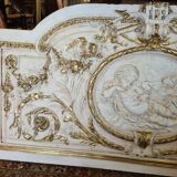 Pediment panel with stucco and wood angels