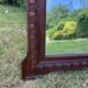 Antique carved wooden mirror