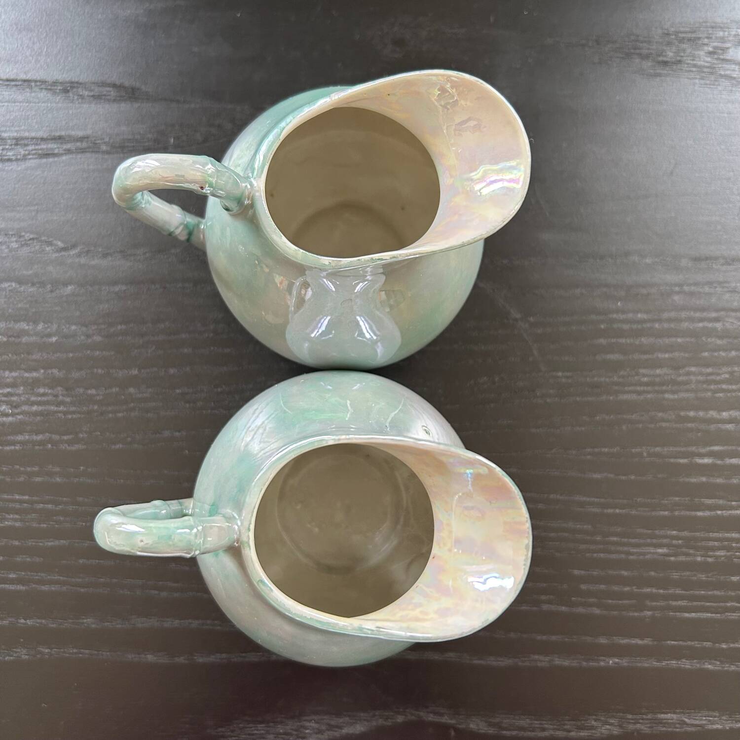 Pair of iridescent blue pitchers