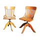 2 old swivel office chairs in solid wood