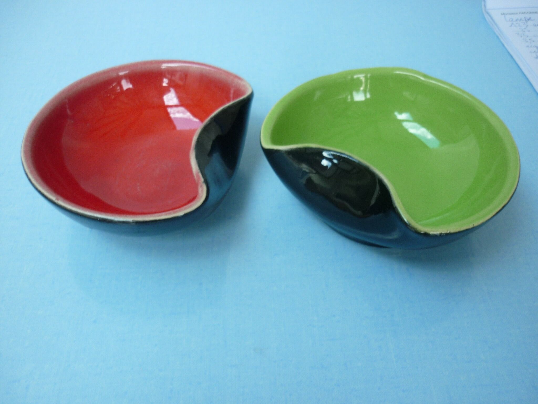 Set of two-colored red and green ceramic cuts on a black background