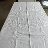 White hand-embroidered square tablecloth at stem stitch