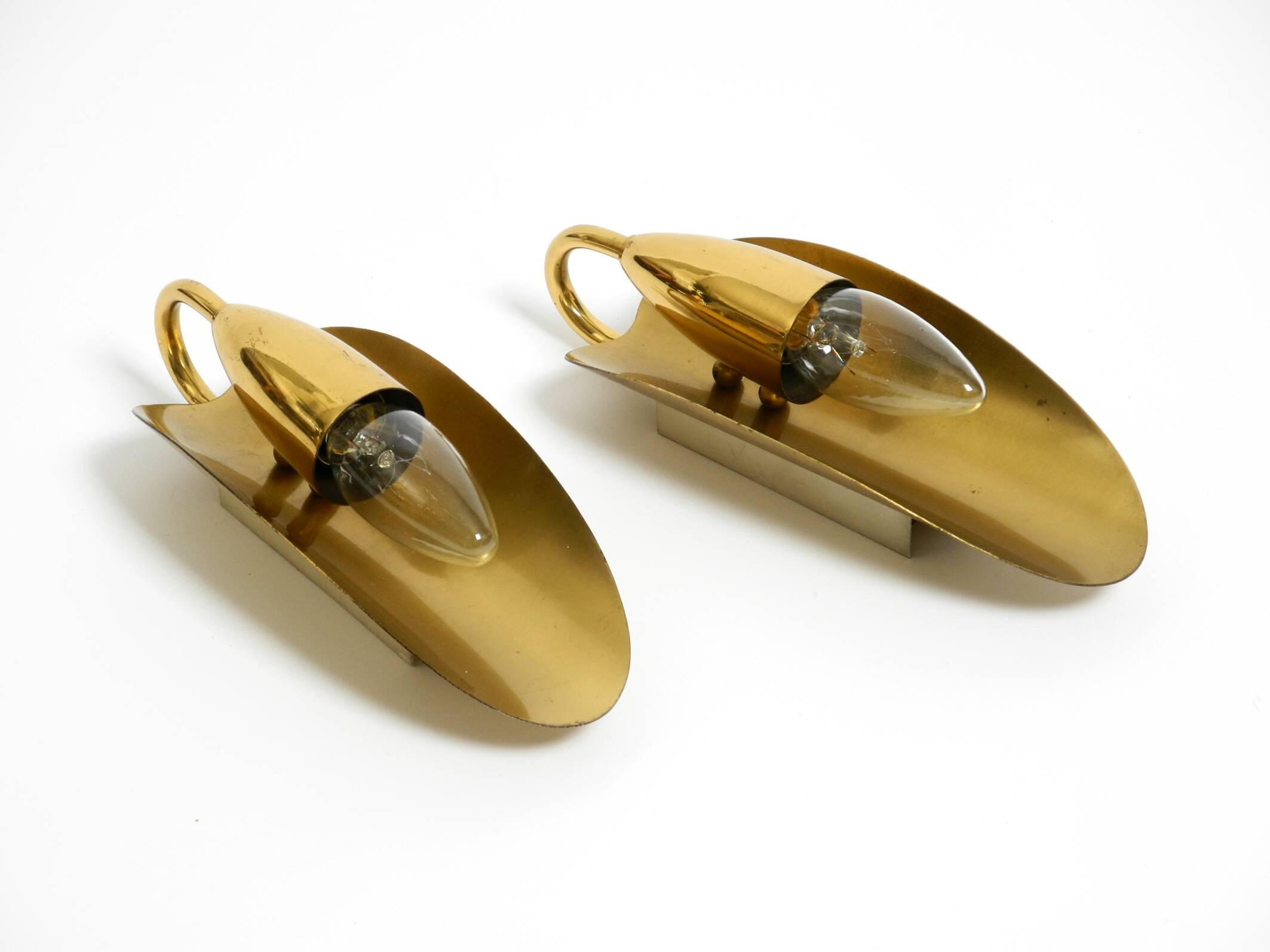 Two magical original Mid Century Modern bag brass wall lamps