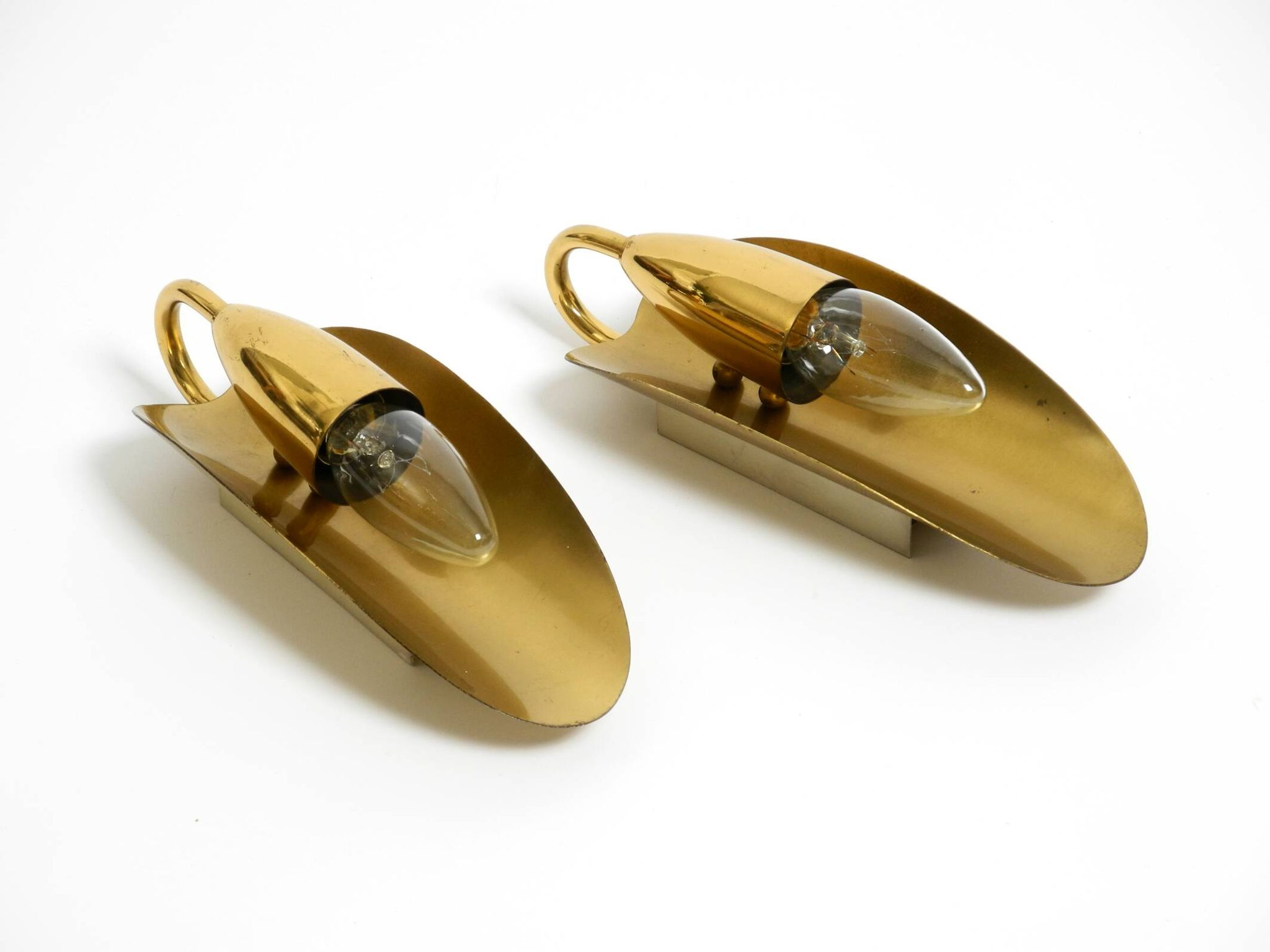 Two magical original Mid Century Modern bag brass wall lamps