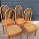 Set of 4 vintage Baumann chairs in honey wood and cane.