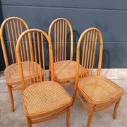 Set of 4 vintage Baumann chairs in honey wood and cane.