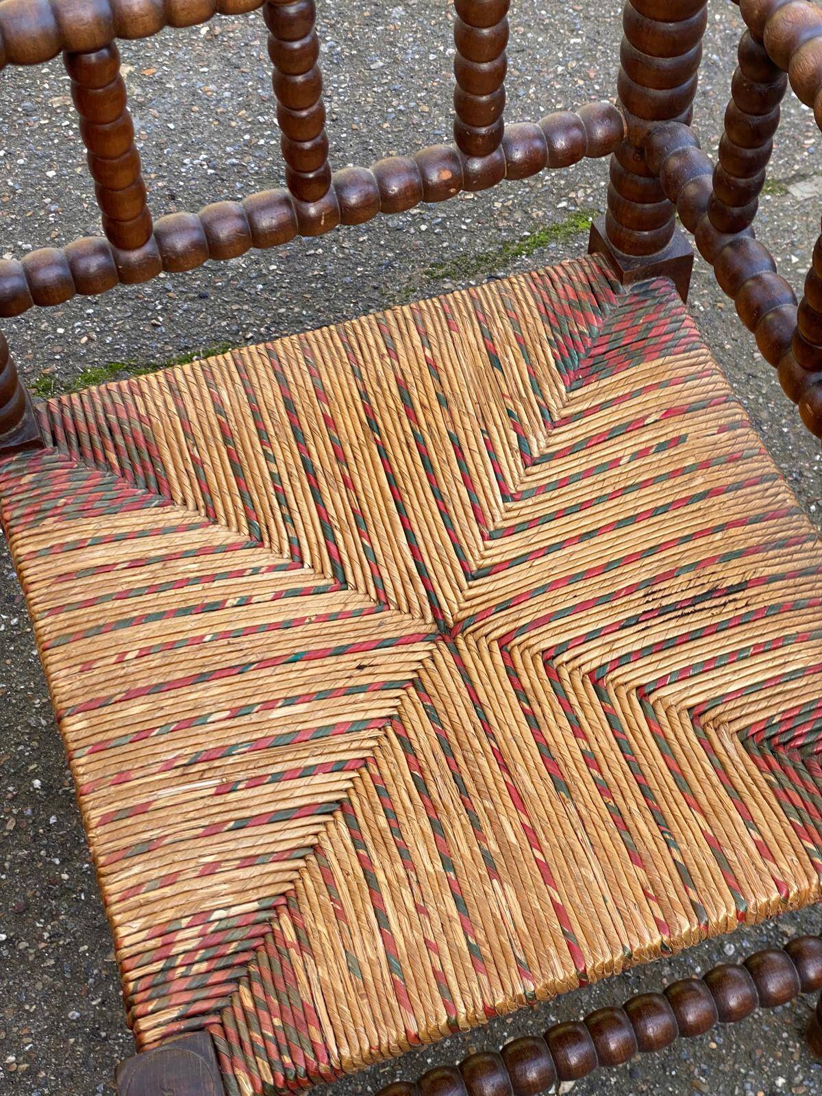 19th-century turned wooden corner chair with rush seating.