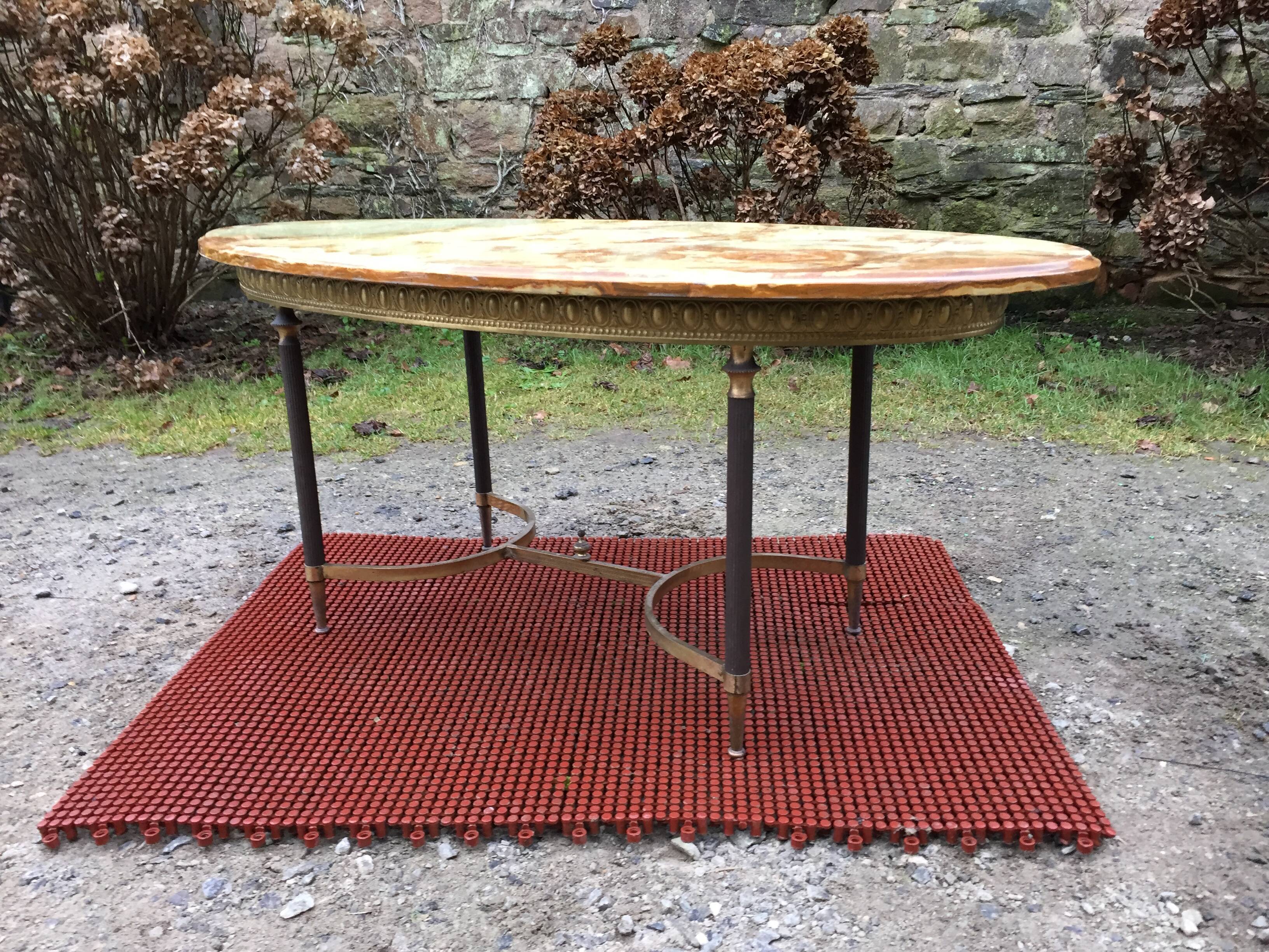 Vintage brass coffee table and oval alabaster top.