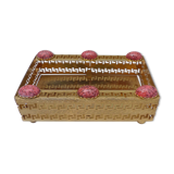 Empty pocket in gold metal and pink stones