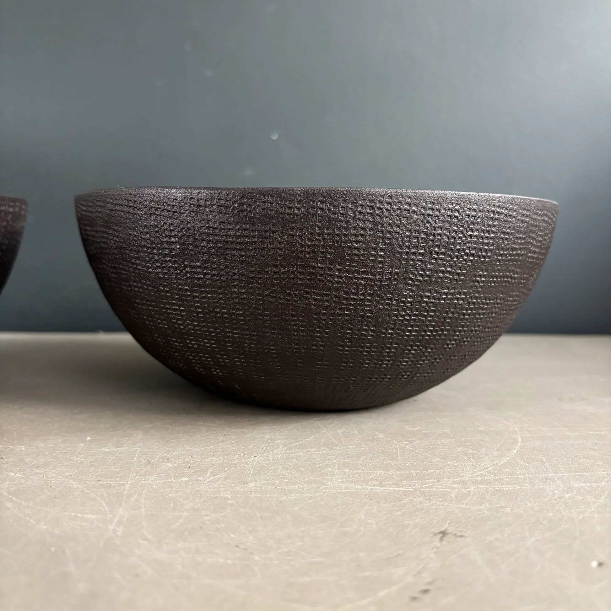 Pair of black lacquered metal catchall bowls