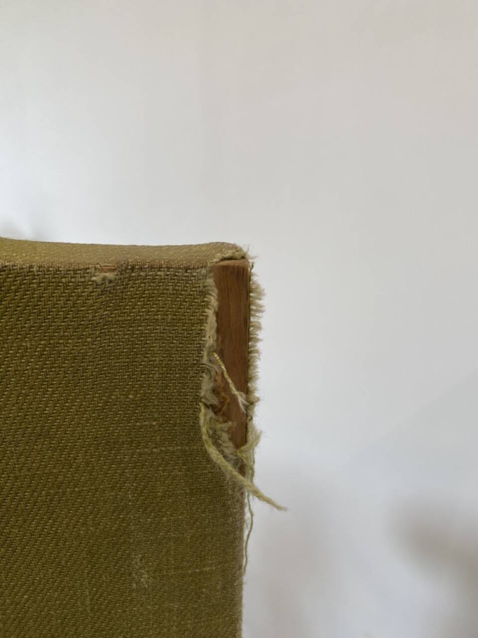 Olive green upholstered armchairs with studs