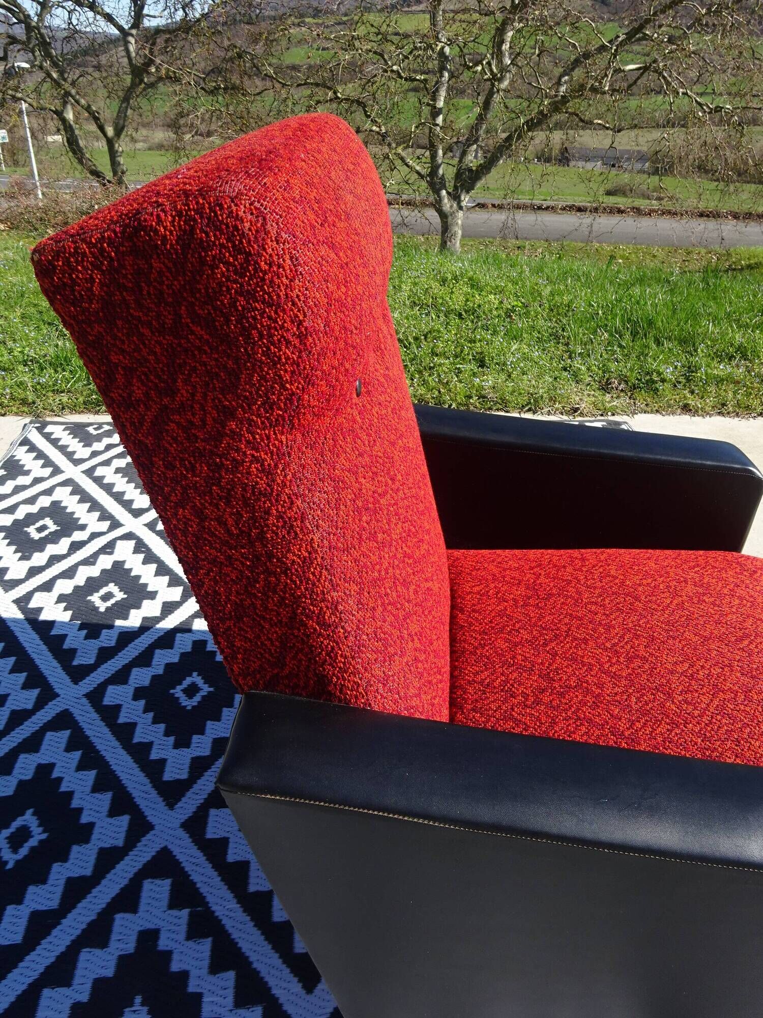 Vintage pair of red and black armchairs