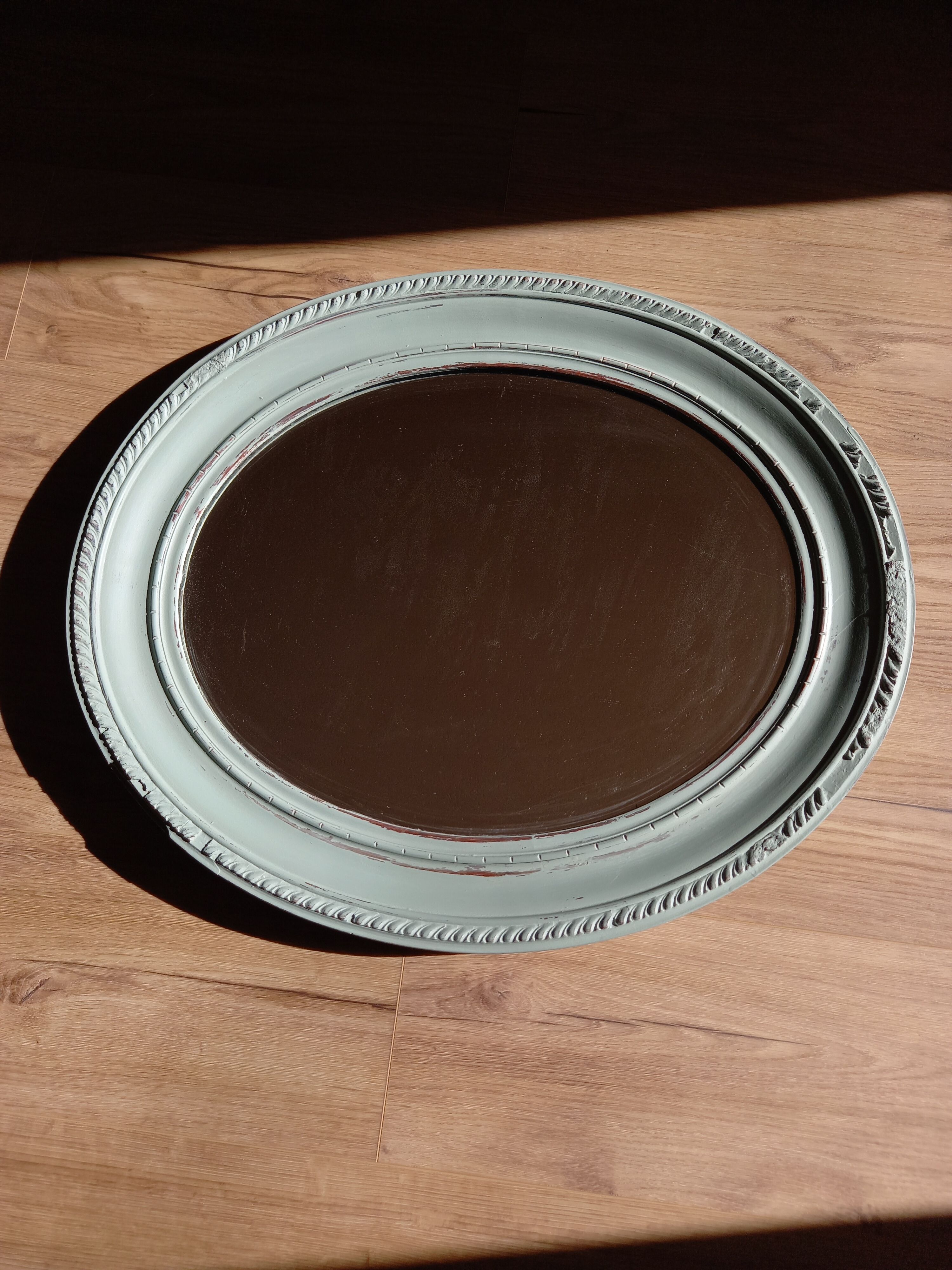 Green oval mirror