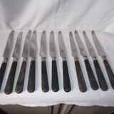 Set of 11 black wooden sleeve knives