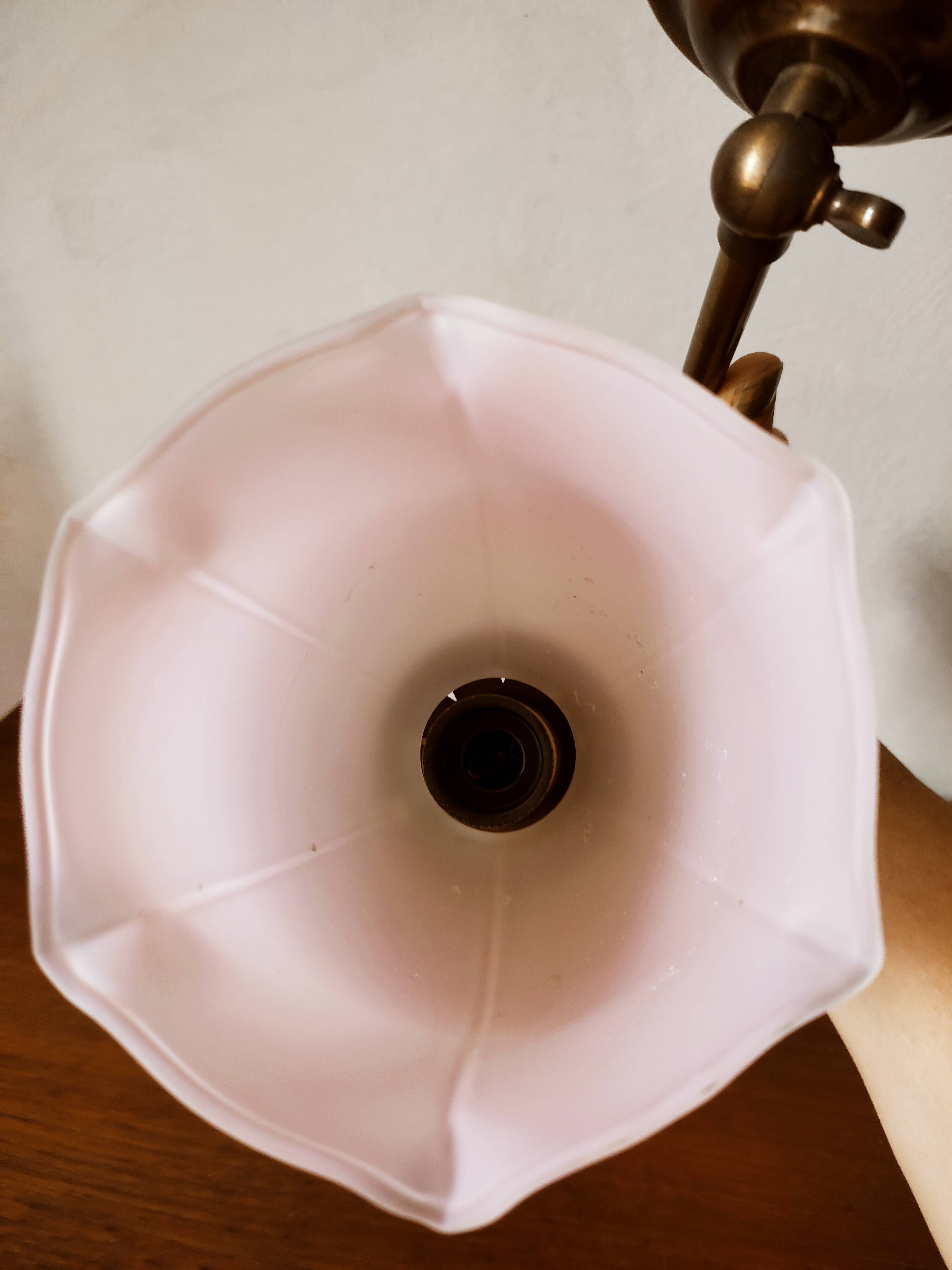 Brass wall lamp with pale pink bell
