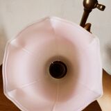 Brass wall lamp with pale pink bell