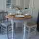 Oval table with beaded grey patinated flaps, wooden tray