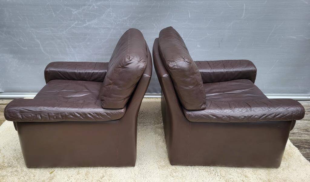 Pair of chocolate leather lounge chairs