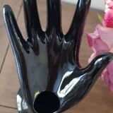 Hand holds black jewelry, ring sizer, soliflore, vintage French, 50s