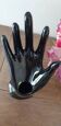 Hand holds black jewelry, ring sizer, soliflore, vintage French, 50s
