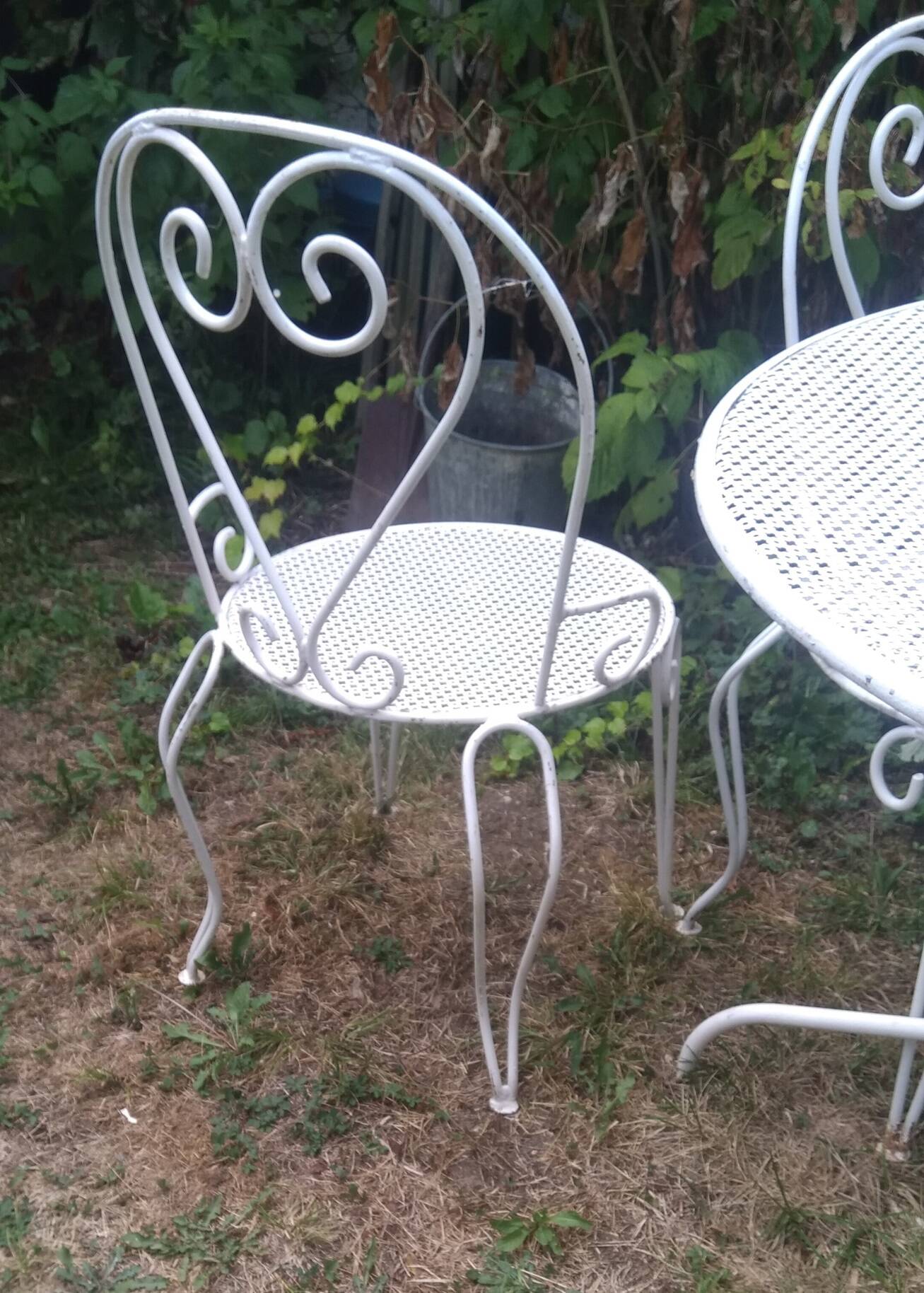 Mategot-style perforated wrought iron garden furniture with table and armchairs