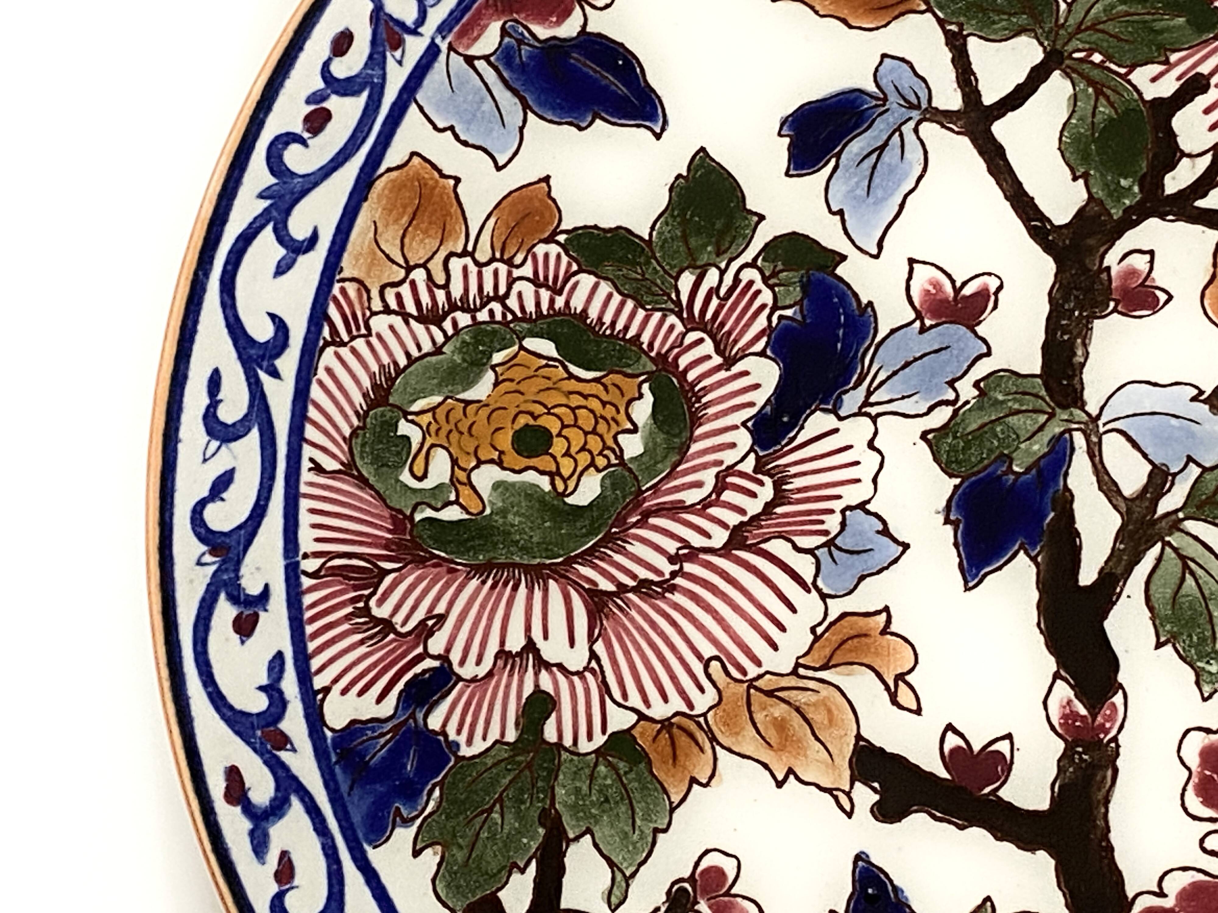 Round plate in Gien earthenware model Peonies