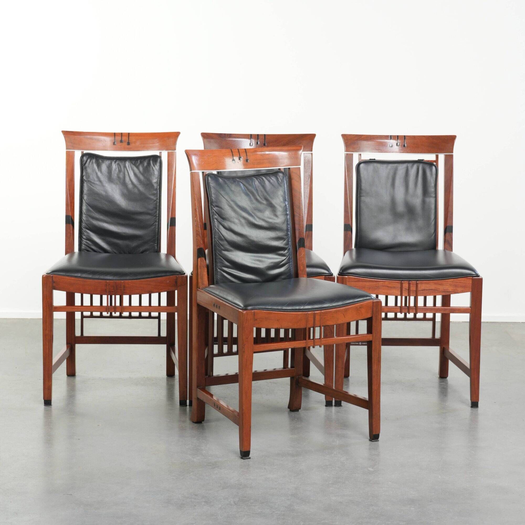 Elegant set of four black cowhide and wooden Art Deco dining chairs