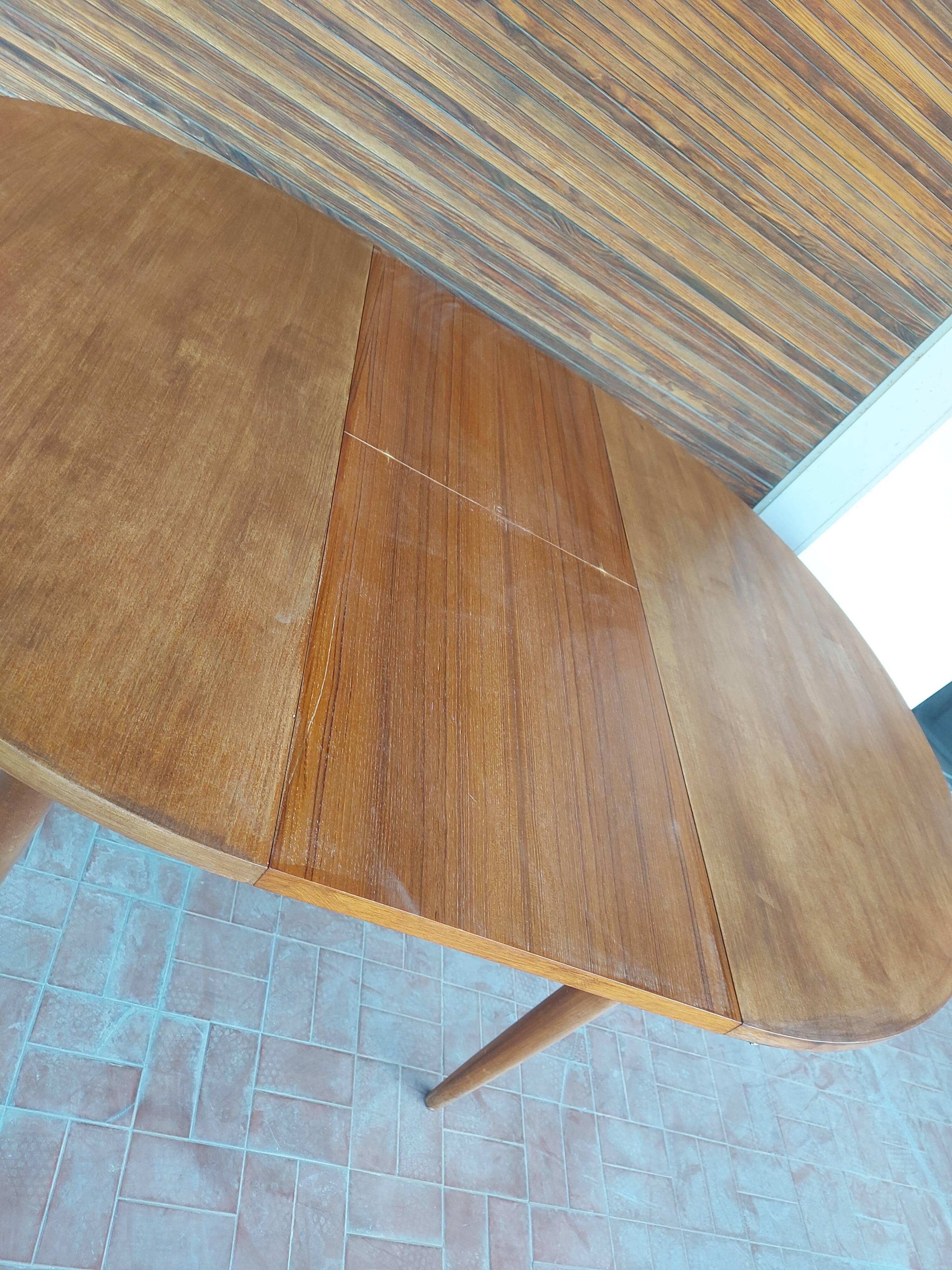 Scandinavian design teak table with extension cord