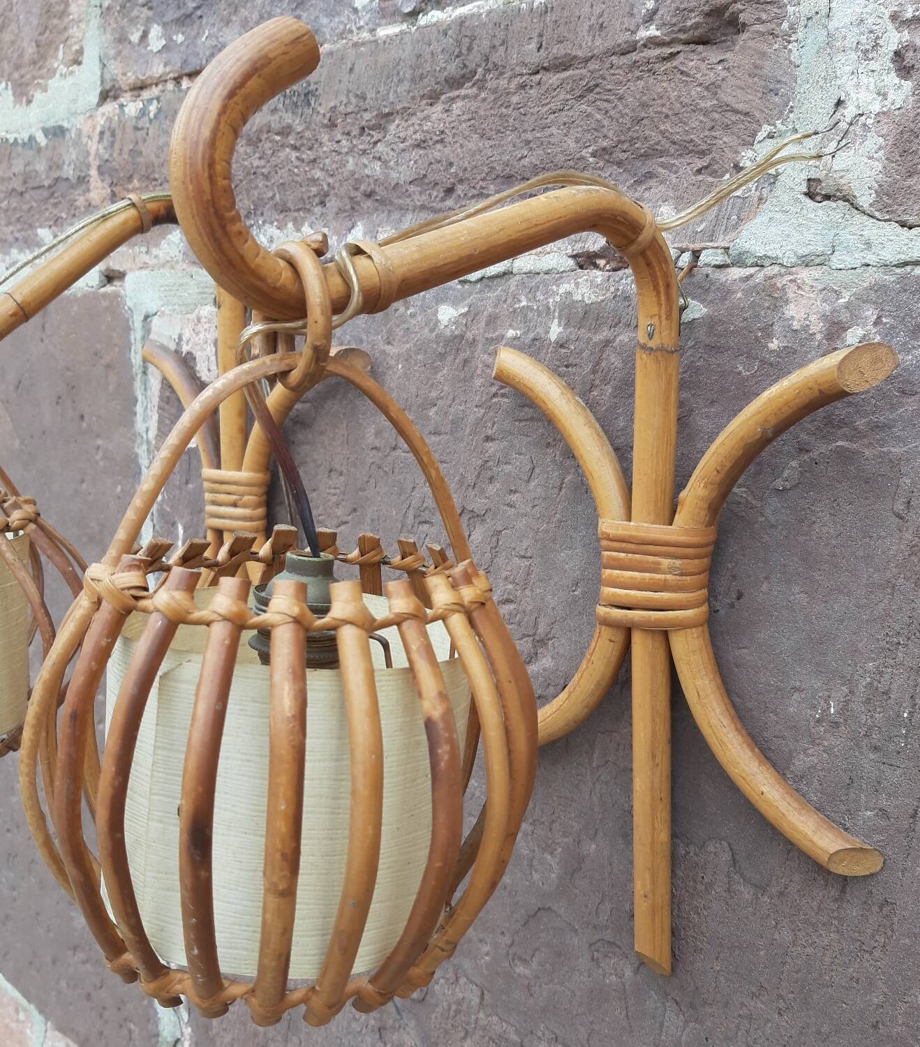 Pair of Louis Sognot rattan wall lights.