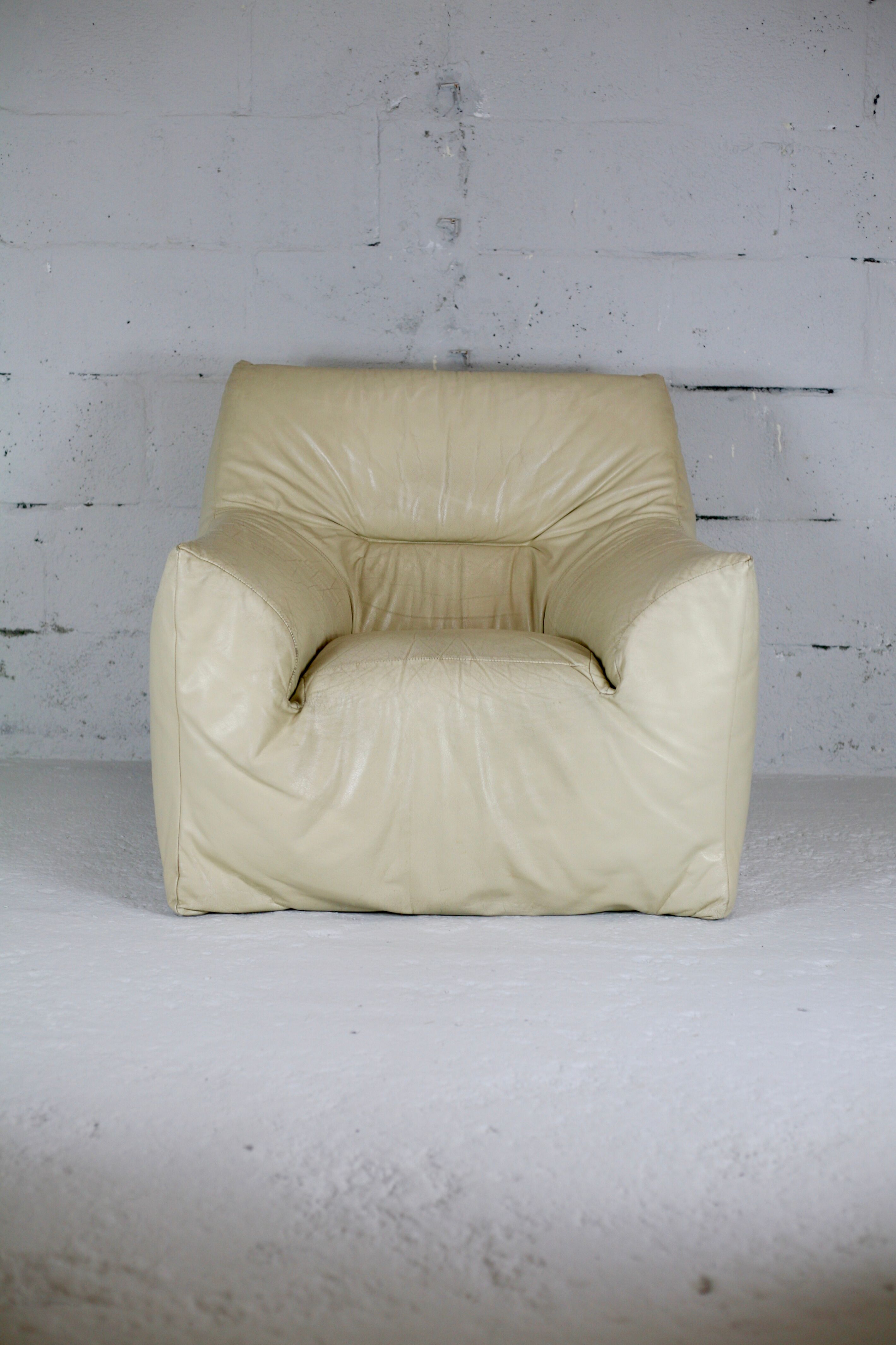 Leather armchair and cream-coloured foam, France , circa 1970
