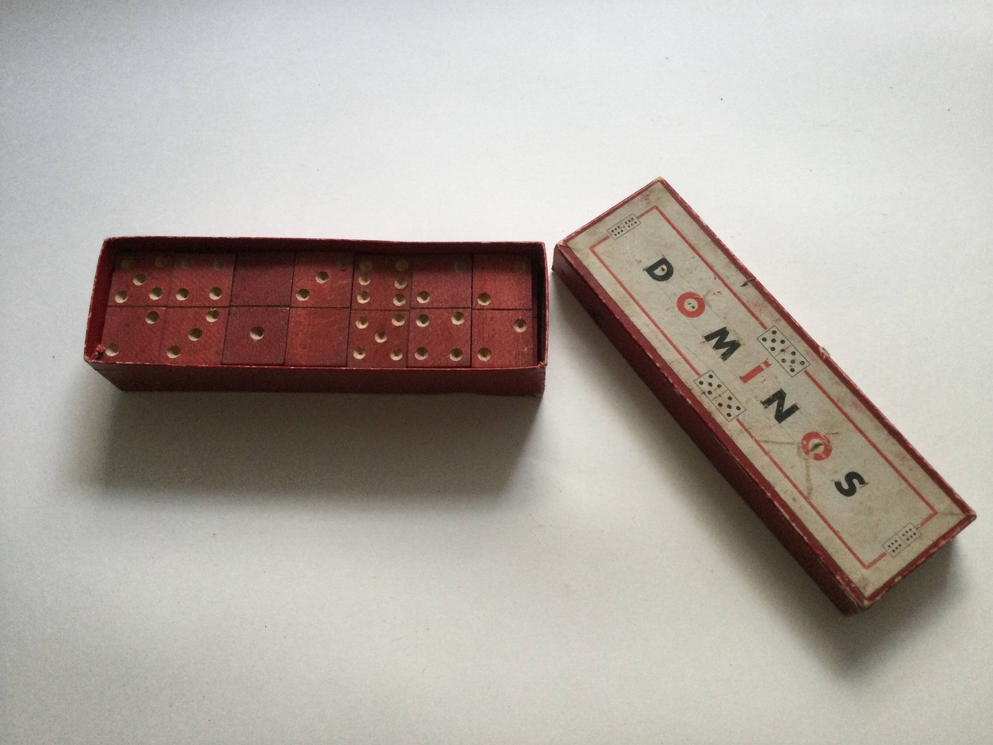 Red wooden dominoes game from the 50s old toy