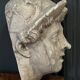 Antique plaster sculpture of a female face from the early 20th century