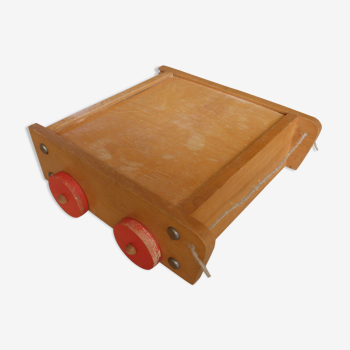 Old raw wood construction game in its cart