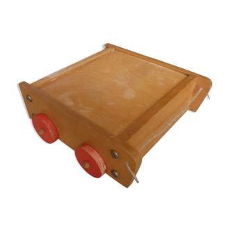 Old raw wood construction game in its cart