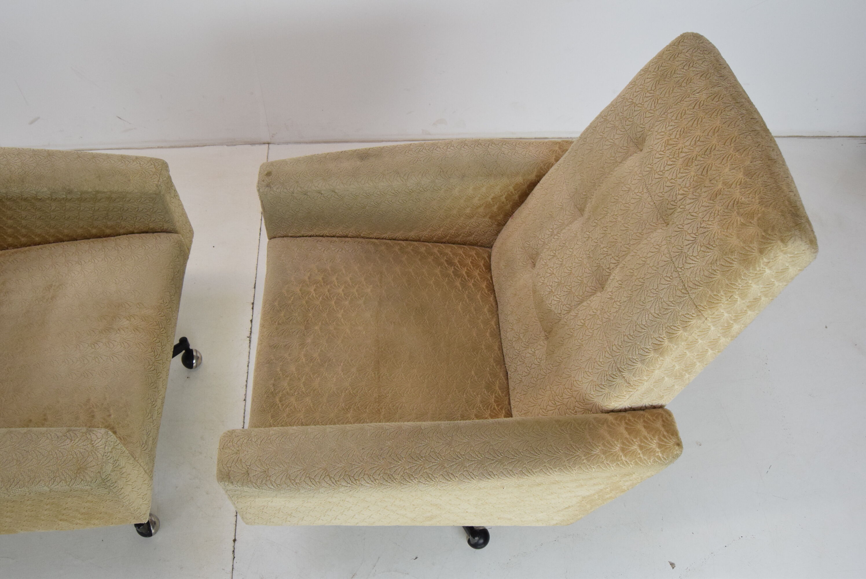 Pair of mid-century swivel armchairs with wheels 1970's