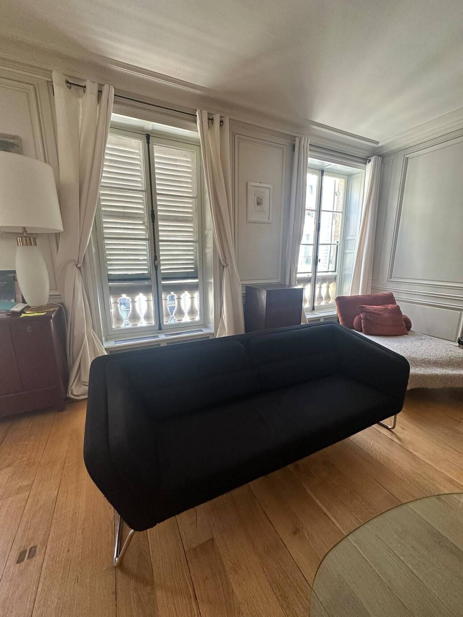 Black 3-seater sofa signed by a designer.