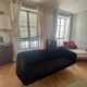 Black 3-seater sofa signed by a designer.