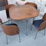 Table with vintage recessed chair