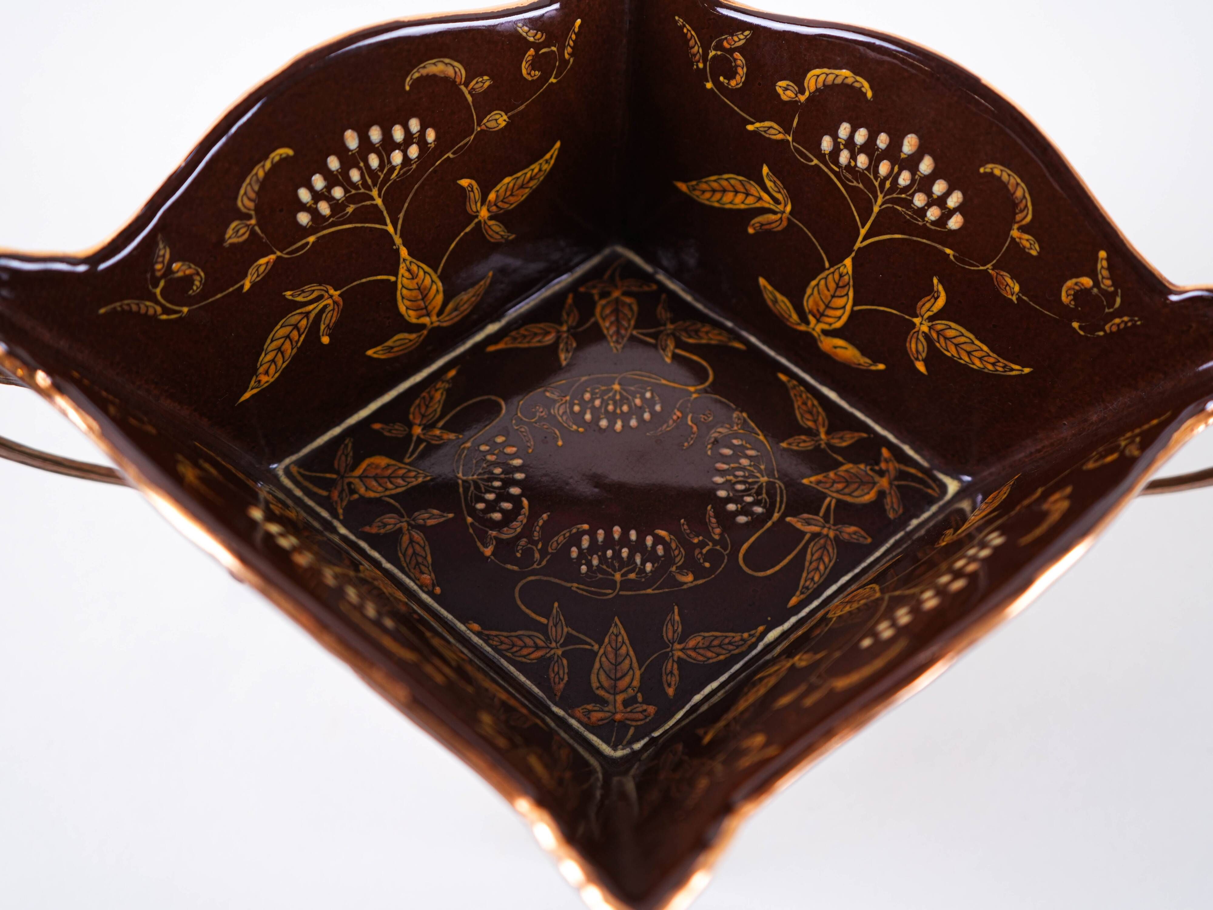 Art Nouveau platter with ceramic insert in openwork metal basket, burgundy glaze with gilt accents