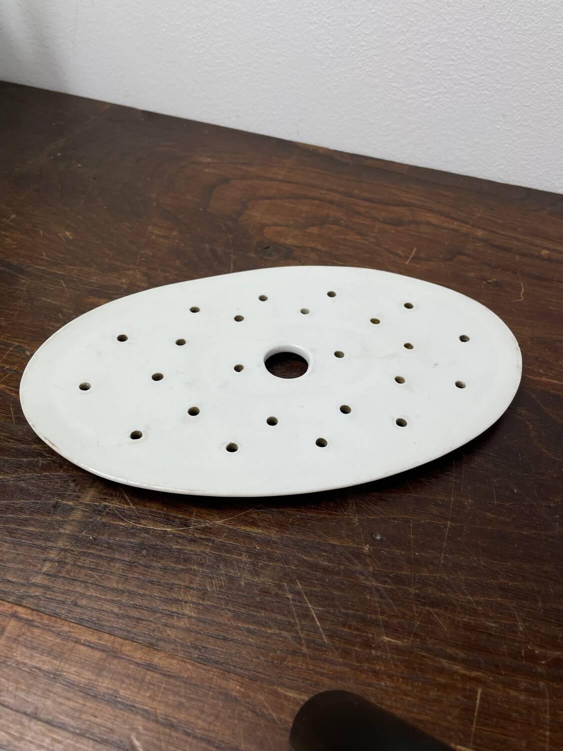 Old iron clay draining plate