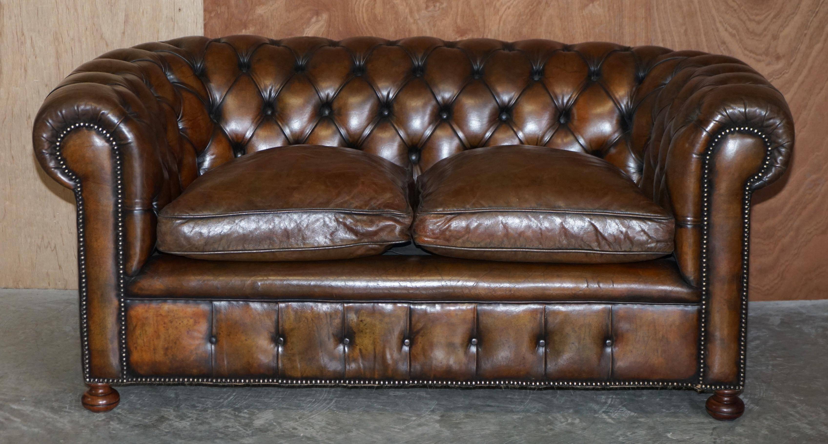 Restored leather Chesterfield sofa, walnut legs.